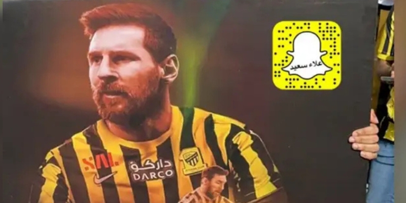 Al-Ittihad fans with Messi banner